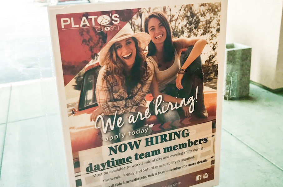 A Hiring sign inside Plato's Closet