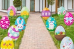 sewrung 12 PCS Eggs Decorations Outdoor Easter Yard Signs in a yard.