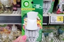 hand holding an air wick scented oil warmer at dollar general