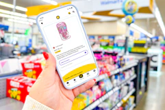 hand holding a smartphone displaying a 1-clip coupon in the kcl app