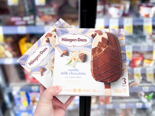 hand holding two boxes of ice cream bars