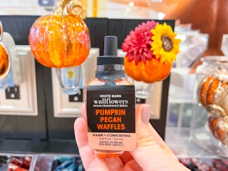 hand holding wallflowers fragrance refill