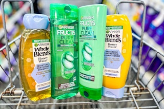 four bottles of garnier shampoo in a cart