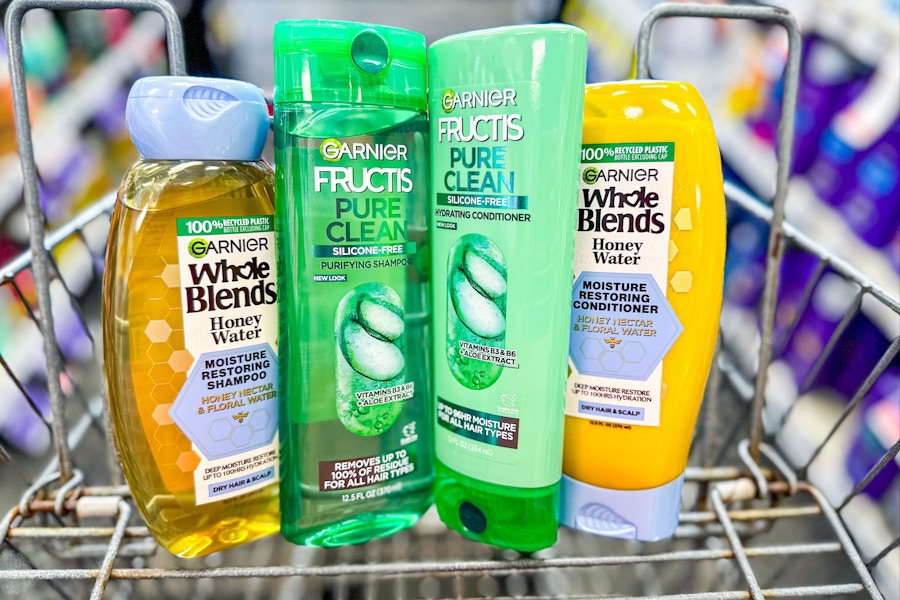 four bottles of garnier shampoo in a cart