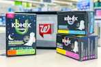 kotex pads in front of a walgreens basket