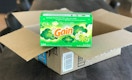 A box of gain dryer sheets, placed on an open Amazon delivery box.