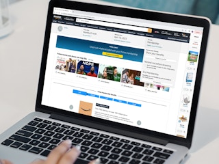 a person looking at the amazon website on their macbook
