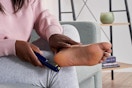 a woman using the dr scholls callus remover