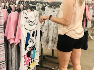 woman looks at Disney pjs at JCPenney