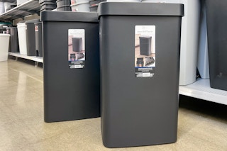 two Mainstays motion sensor trash cans in a Walmart cart