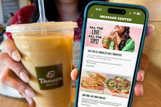 someone holding a panera cup and a phone showing the unlimited sip club offer