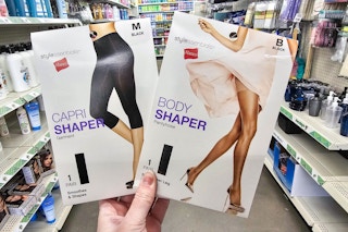person holding hanes shapewear in an aisle