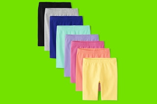 8 pairs of bike shorts on a bright green background