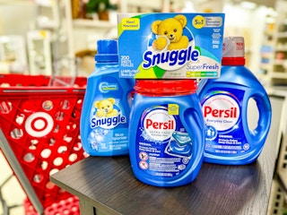 persil and snuggle laundry items sitting on a table in front of a target cart