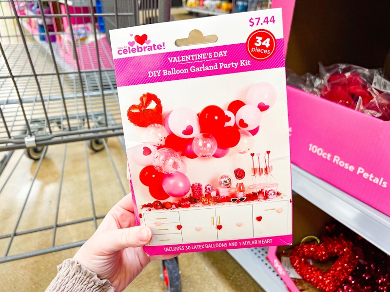 hand holding balloon gardland party kit at walmart