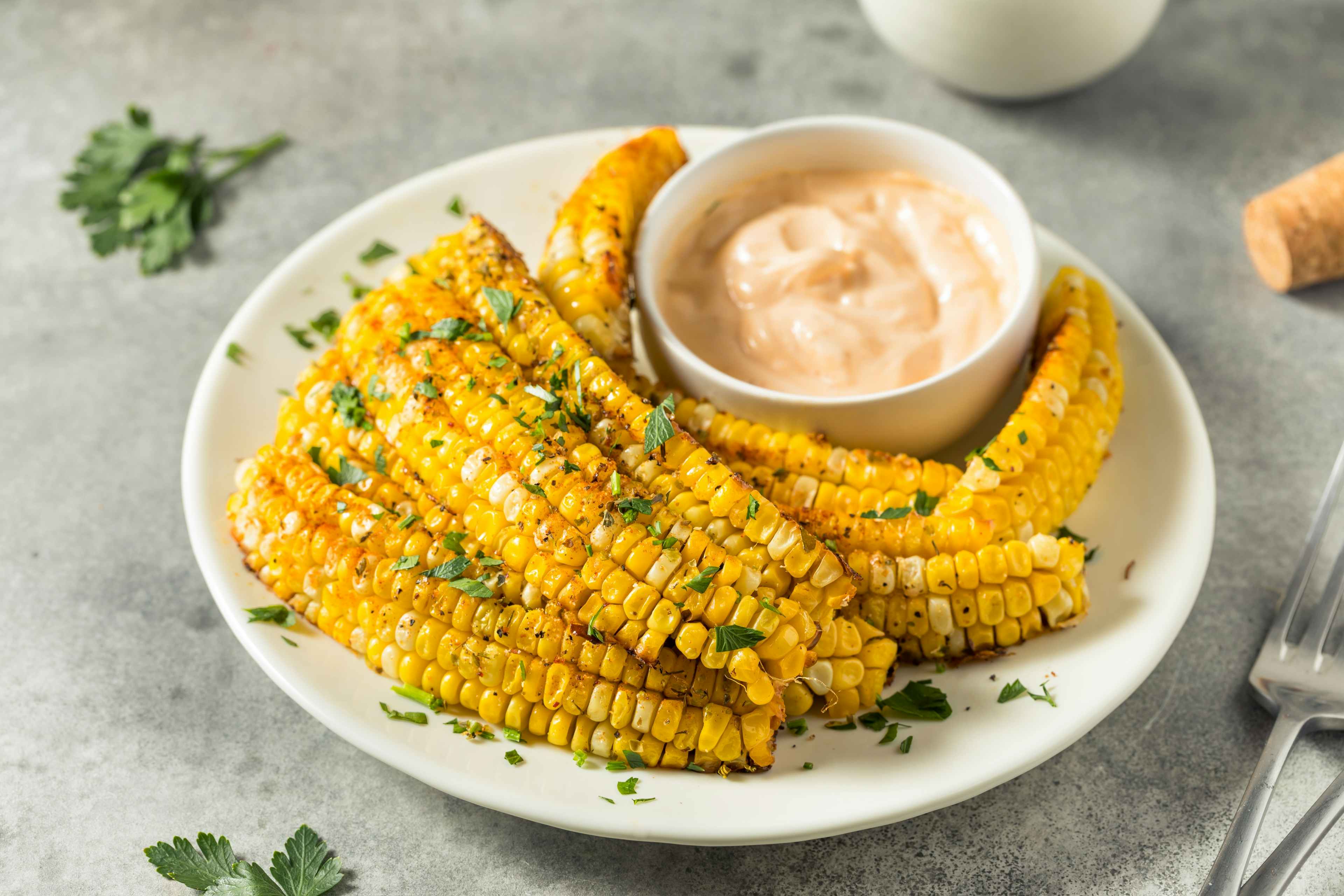 vegan corn ribs on a plate with sauce