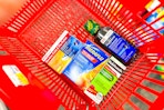cvs health, theraflu, robitussin medications in a red basket