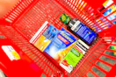 cvs health, theraflu, robitussin medications in a red basket