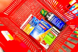 cvs health, theraflu, robitussin medications in a red basket