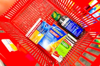 cvs health, theraflu, robitussin medications in a red basket