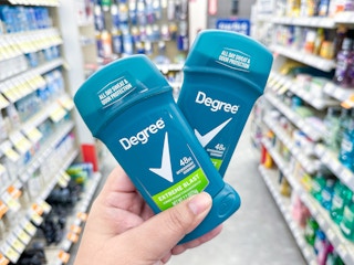 hand holding degree deodorant in walgreens aisle