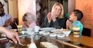 family at benihana hibachi table with chef preparing food