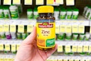 hand holding nature made zinc supplements in walgreens