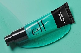 a tube of elf power grip primer on a teal background