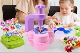a child and mother playing with a flower bouquet kit