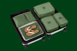 a suitcase with green packing cubes