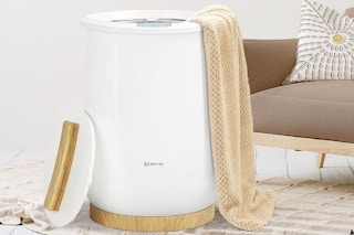 a towel warmer in a bathroom next to a bathtub