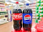coca cola pepsi soda 2 liters on canned soda stack in store