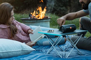 a camping table on a sleeping bag
