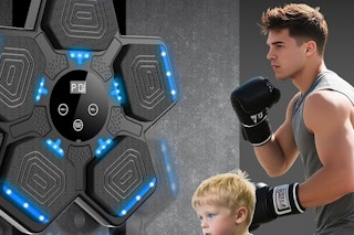 a man and child using a boxing machine
