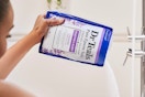 person pouring a bag of dr teals epsom salt soak