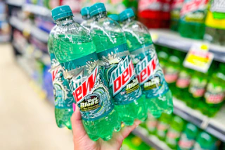 hand holding up a mountain dew 6-pack