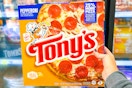 hand holding tonys pizza