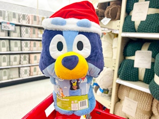 hand holding a bluey hooded blanket at target