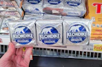 hand holding a pack of klondike bars