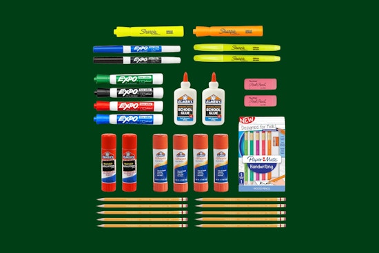 school supplies on a green background