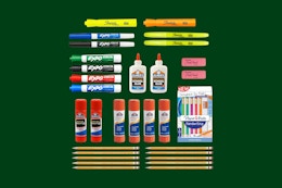 school supplies on a green background