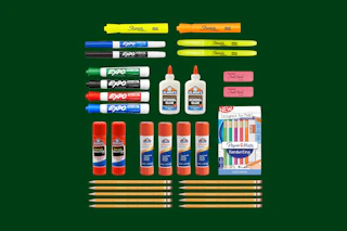 school supplies on a green background