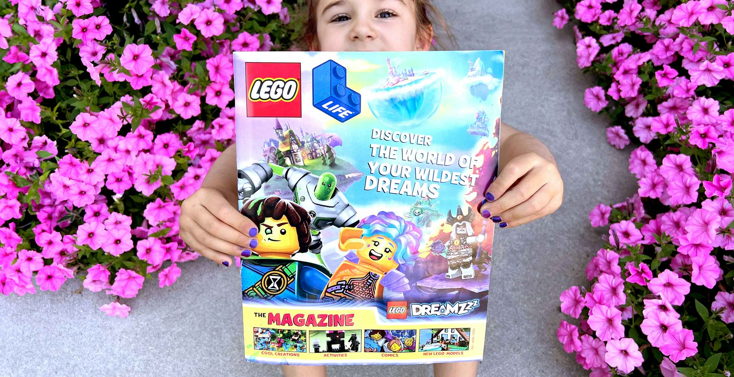 child-holding-lego-magazine-flowers-feature