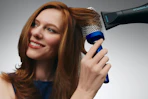 a woman using a bio ionic brush