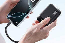a woman holding electronics