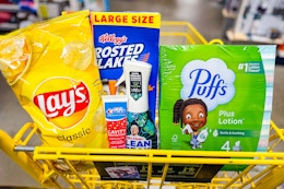 lays, puffs, frosted flakes, mr clean, crest in a dollar general shopping cart