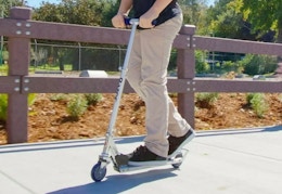 child riding on a Razor scooter