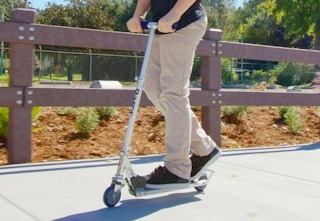 child riding on a Razor scooter