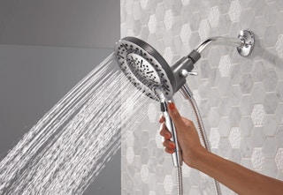 hand holding the Delta shower head