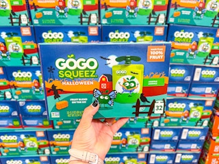 hand holding a box of gogo squeez halloween pouches